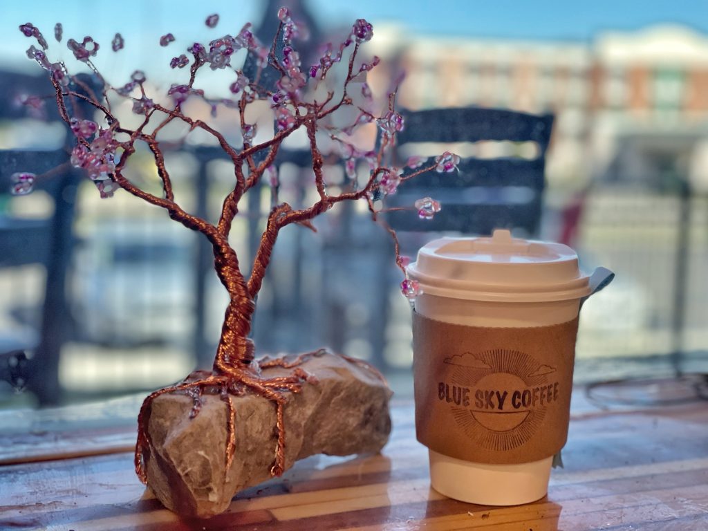 Wire Wrapped Tree sitting next to a Blue Sky Coffee Cup